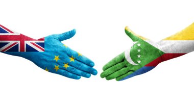 Tuvalu ve Comoros bayrakları arasındaki el sıkışma ellerinde resmedilmiş şeffaf görüntü.