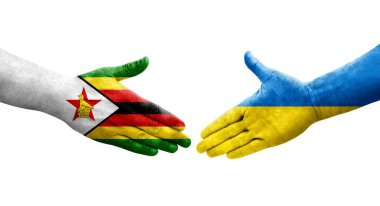 Ukrayna ve Zimbabwe bayrakları arasındaki el sıkışma ellerinde izole şeffaf görüntü.