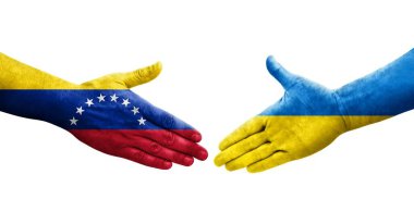 Ukrayna ve Venezuela bayrakları arasındaki el sıkışma ellerinde resmedilmiş şeffaf görüntü.