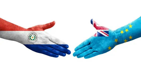 stock image Handshake between Paraguay and Tuvalu flags painted on hands, isolated transparent image.