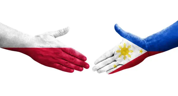 手に描かれたフィリピンとポーランドの旗の間の握手 隔離された透明なイメージ — ストック写真