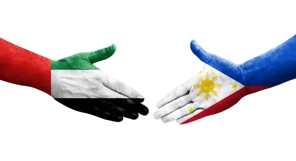 手に描かれたフィリピンとUaeの旗の間の握手 隔離された透明画像 — ストック写真