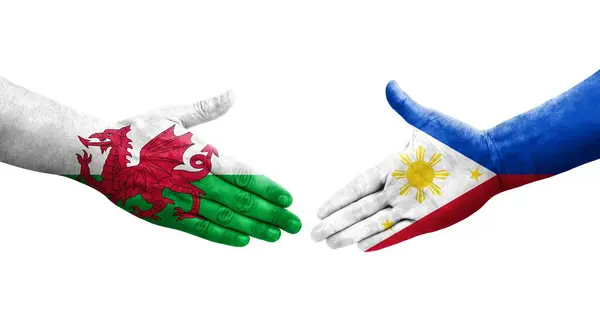Uścisk Dłoni Między Filipinami Walią Flagi Malowane Rękach Odizolowany Przezroczysty — Zdjęcie stockowe