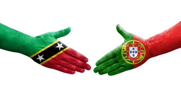 Uścisk Dłoni Między Portugalią Saint Kitts Flagami Nevis Namalowanymi Dłoniach — Zdjęcie stockowe