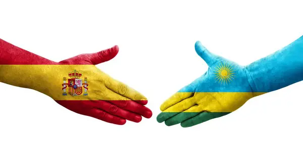 르완다와 스페인에서는 깃발을 손으로 휘감고 분리되어 이미지를 르완다와 스페인 악수를 — 스톡 사진