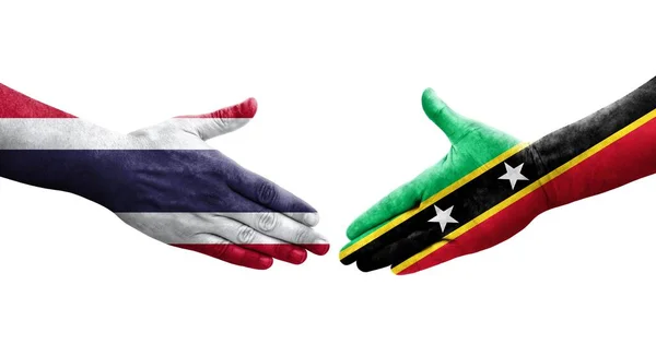 Handdruk Tussen Saint Kitts Nevis Thailand Vlaggen Geschilderd Handen Geïsoleerde — Stockfoto