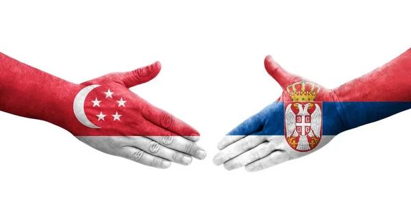 Handslag Mellan Serbien Och Singapore Flaggor Målade Händer Isolerad Transparent — Stockfoto