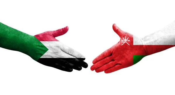 Stretta Mano Tra Sudan Oman Bandiere Dipinte Mani Isolata Immagine — Foto Stock