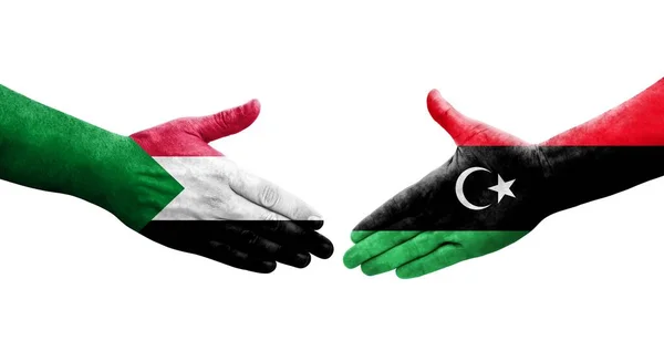 Händedruck Zwischen Sudanesischen Und Libyschen Flaggen Auf Hände Gemalt Isoliertes — Stockfoto