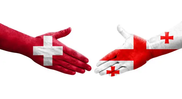 Uścisk Dłoni Między Szwajcarią Gruzją Flagi Malowane Rękach Odizolowany Przezroczysty — Zdjęcie stockowe