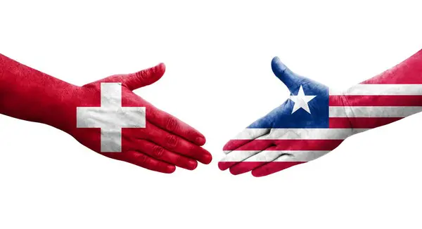 Uścisk Dłoni Między Szwajcarią Liberią Flagi Malowane Rękach Odizolowany Przezroczysty — Zdjęcie stockowe