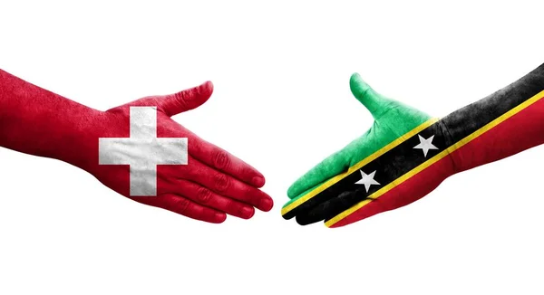 Uścisk Dłoni Między Szwajcarią Saint Kitts Flagami Nevis Namalowanymi Dłoniach — Zdjęcie stockowe