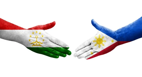 Uścisk Dłoni Między Tadżykistanem Flagami Filipin Namalowanymi Rękach Odizolowany Przezroczysty — Zdjęcie stockowe