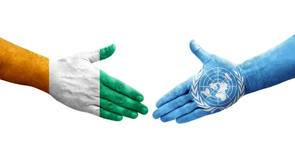 Händedruck Zwischen Flaggen Der Vereinten Nationen Und Der Elfenbeinküste Auf — Stockfoto