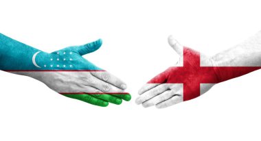 Özbekistan ve İngiltere arasındaki el sıkışma ellerinde boyanmış bayraklar, izole edilmiş şeffaf görüntü.