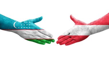 Özbekistan ile Avusturya bayrakları arasındaki el sıkışma, izole edilmiş şeffaf görüntü.