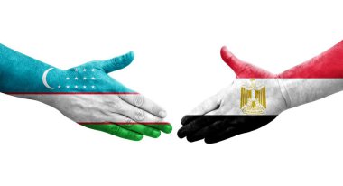 Özbekistan ile Mısır bayrakları arasındaki el sıkışma, izole edilmiş şeffaf görüntü.