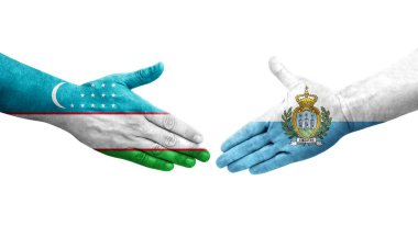 Özbekistan ile San Marino bayrakları arasındaki el sıkışma, izole şeffaf görüntü.