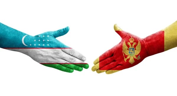 Handshake Entre Uzbequistão Montenegro Bandeiras Pintadas Mãos Imagem Transparente Isolada — Fotografia de Stock