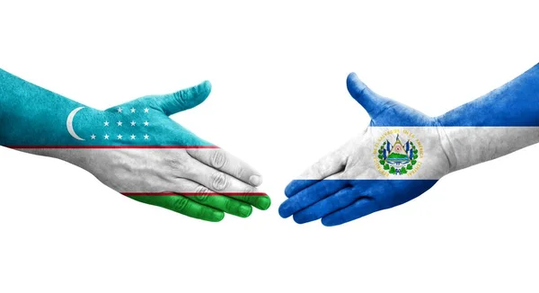 Рукопожатие Между Узбекистаном Сальвадором Раскрашенные Руках Флаги Изолированное Прозрачное Изображение — стоковое фото