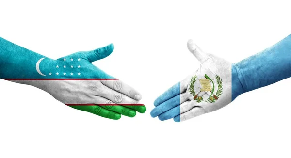 Uścisk Dłoni Między Flagami Uzbekistanu Gwatemali Namalowanymi Rękach Odizolowany Przezroczysty — Zdjęcie stockowe