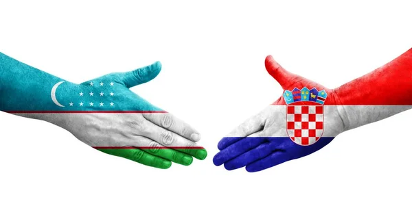 Stretta Mano Tra Uzbekistan Croazia Bandiere Dipinte Mani Immagine Isolata — Foto Stock