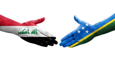 Solomon Adaları ve Irak bayrakları arasındaki el sıkışma, izole edilmiş şeffaf görüntü.