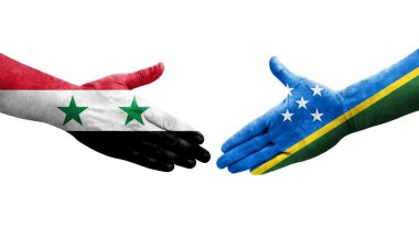 Solomon Adaları ve Suriye bayrakları arasındaki el sıkışma, izole edilmiş şeffaf görüntü.