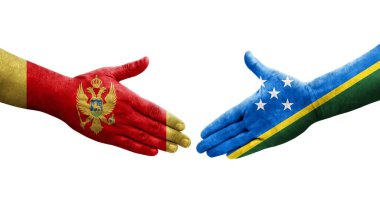 Solomon Adaları ile Karadağ bayrakları arasındaki el sıkışma, izole edilmiş şeffaf görüntü.