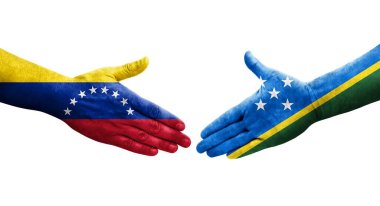 Solomon Adaları ve Venezuela bayrakları arasındaki el sıkışma ellerinde izole şeffaf görüntü.