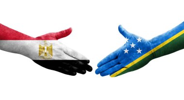 Solomon Adaları ve Mısır bayrakları arasındaki el sıkışma, izole edilmiş şeffaf görüntü.