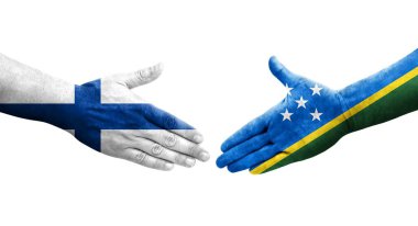 Solomon Adaları ile Finlandiya bayrakları arasındaki el sıkışma, izole edilmiş şeffaf görüntü.