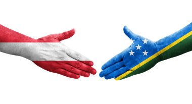 Solomon Adaları ile Avusturya bayrakları arasındaki el sıkışma..