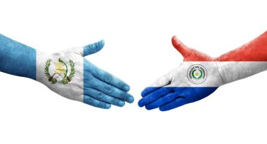 Ellerinde Paraguay ve Guatemala bayrakları arasında el sıkışma, izole şeffaf görüntü.