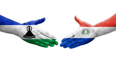 Ellerinde Paraguay ve Lesotho bayrakları arasında el sıkışma, izole şeffaf görüntü.