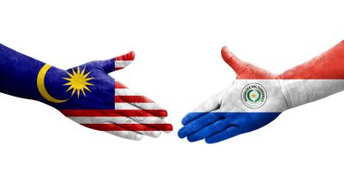 Ellerinde Paraguay ve Malezya bayrakları arasında el sıkışma, izole şeffaf görüntü.