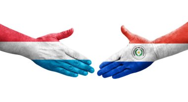 Ellerinde Paraguay ve Lüksemburg bayrakları arasında el sıkışma, izole saydam görüntü.