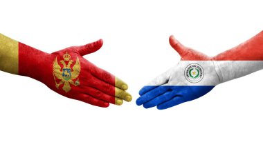 Ellere boyanmış Paraguay ve Karadağ bayrakları arasındaki el sıkışma, izole edilmiş şeffaf görüntü.