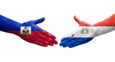 Ellerinde Paraguay ve Haiti bayrakları arasında el sıkışma, izole şeffaf görüntü.