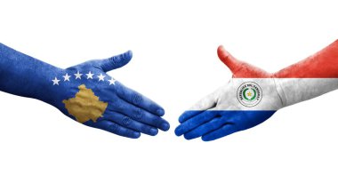 Ellerinde Paraguay ve Kosova bayrakları arasında el sıkışma, izole edilmiş şeffaf görüntü.