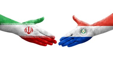 Ellerinde Paraguay ve İran bayrakları arasında el sıkışma, izole şeffaf görüntü.