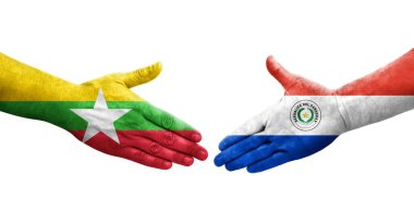 Ellerinde Paraguay ve Myanmar bayrakları arasında el sıkışma, izole şeffaf görüntü.