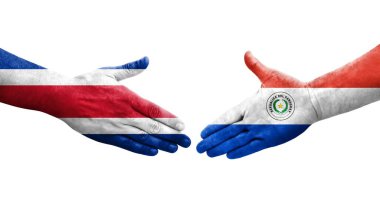 Ellerinde Paraguay ve Kosta Rika bayrakları arasında el sıkışma, izole şeffaf görüntü.