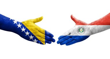 Ellerinde Paraguay ve Bosna bayrakları arasında el sıkışma, izole şeffaf görüntü.