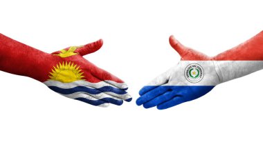 Ellerinde Paraguay ve Kiribati bayrakları arasında el sıkışma, izole şeffaf görüntü.