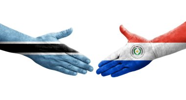 Ellerinde Paraguay ve Botswana bayrakları arasında el sıkışma, izole şeffaf görüntü.