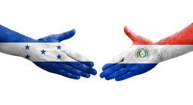 Ellerinde Paraguay ve Honduras bayrakları arasında el sıkışma, izole şeffaf görüntü.