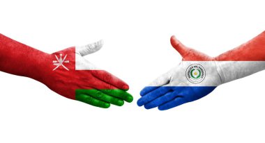 Ellerinde Paraguay ve Umman bayrakları arasında el sıkışma, izole şeffaf görüntü.