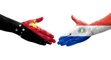 Ellerinde Paraguay ve Papua Yeni Gine bayrakları arasında el sıkışma, izole saydam görüntü.