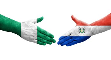 Ellerinde Paraguay ve Nijerya bayrakları arasında el sıkışma, izole şeffaf görüntü.